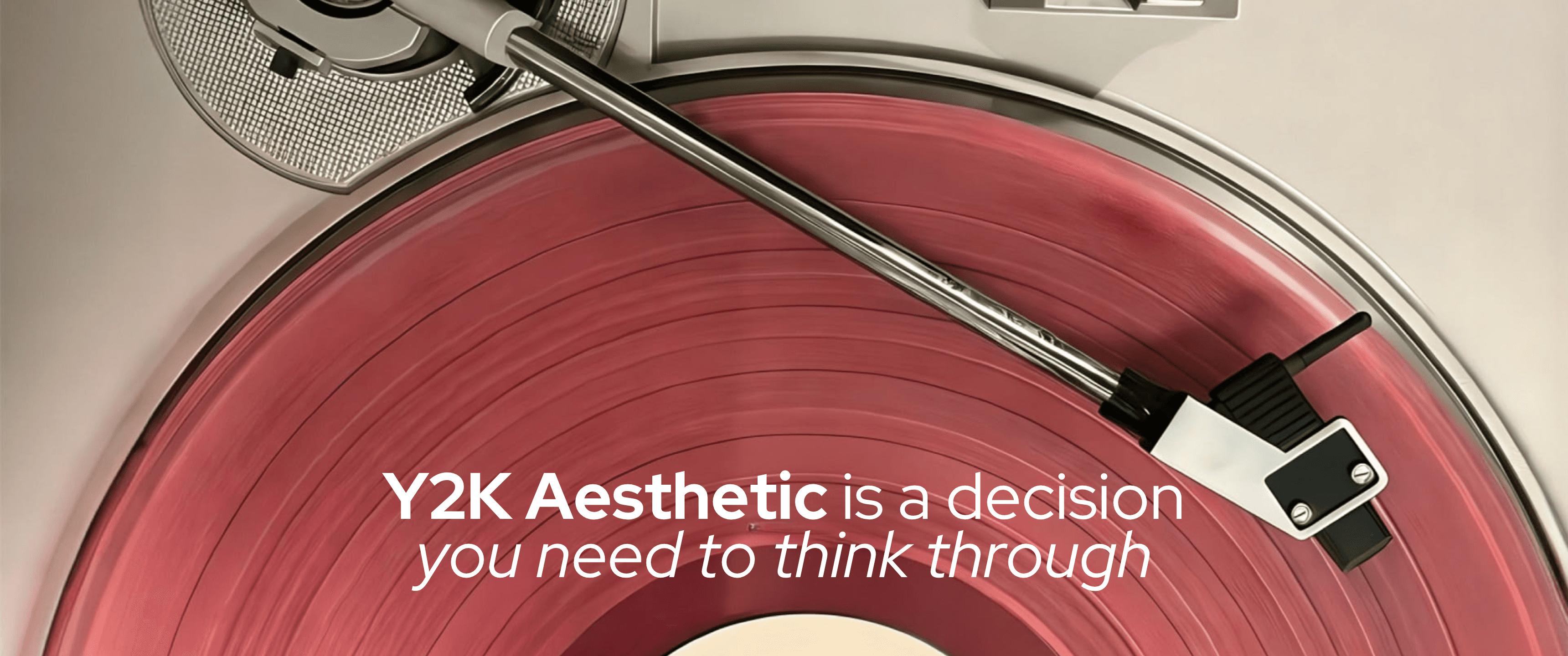 Blog header featuring a close-up of a vintage record player with a pink vinyl record spinning beneath a silver tonearm. Overlaid text reads, “Y2K Aesthetic is a decision you need to think through,” highlighting the resurgence of retro design trends with a nostalgic early-2000s visual style.